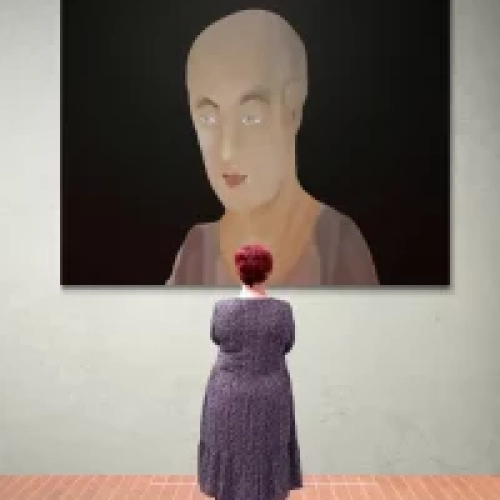 woman standing in front of gallery wall